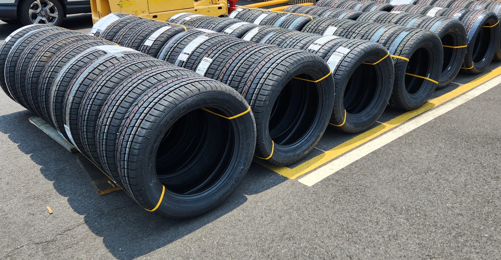 Rows of new General tires staged outside The Toota Group facility